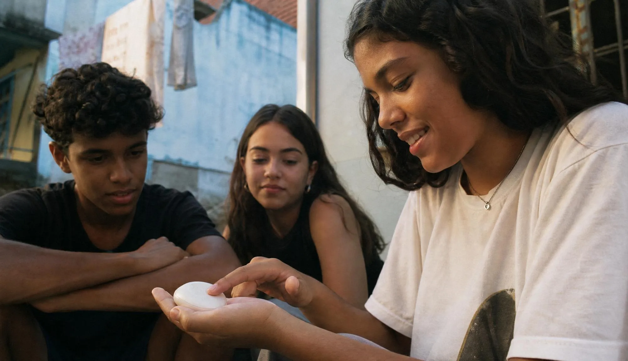 The group gathered around the handheld device.